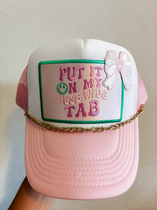 Put It On My Husbands Tab Trucker Hat